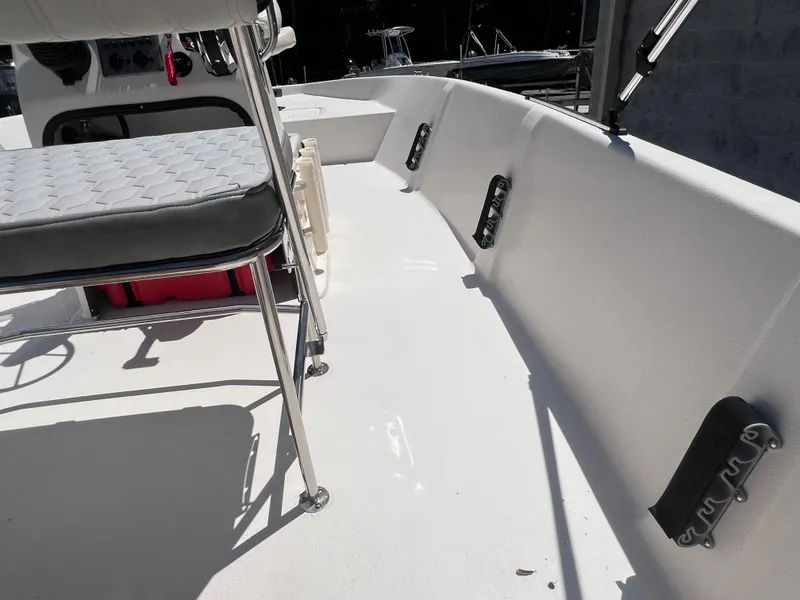 Slide: The Image of 2024 Carolina Skiff EV198 boat interior with seating and rod holders. - 9