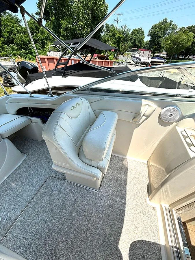 Slide: The Image of 2003 Sea Ray 225 Weekender boat interior with captain's chair and dashboard. - 11