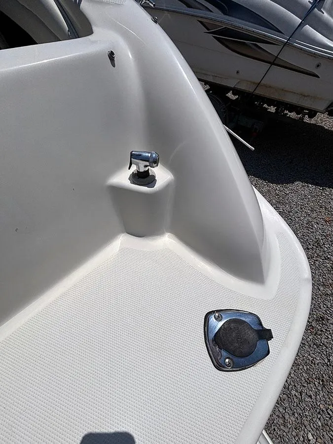 Slide: The Image of 2003 Sea Ray 225 Weekender boat deck with cleat and hatch. - 17