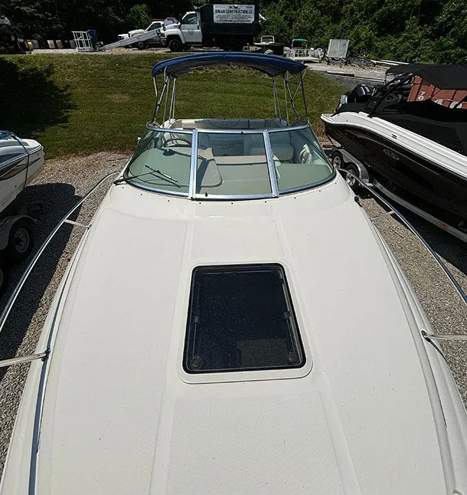 Slide: The Image of 2003 Sea Ray 225 Weekender boat with a sunroof and canopy. - 19