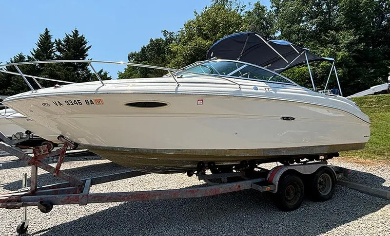 Slide: The Image of 2003 Sea Ray 225 Weekender boat on a trailer. - 4