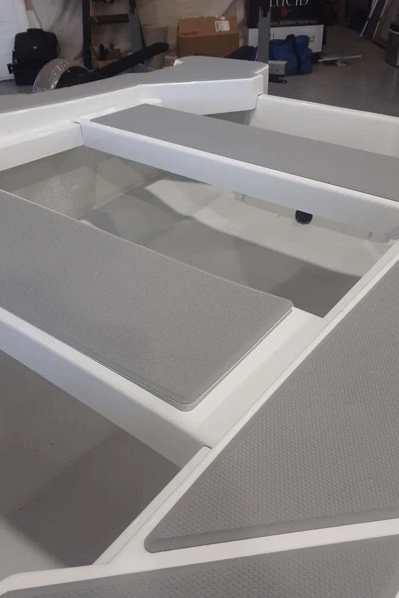 Slide: The Image of 2024 Ultra Lite Tenders ULT 300 boat interior with grey non-slip flooring. - 21