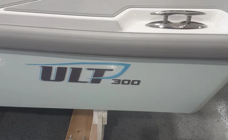 Slide: The Image of 2024 Ultra Lite Tenders Rigged 300 boat side view with logo. - 14