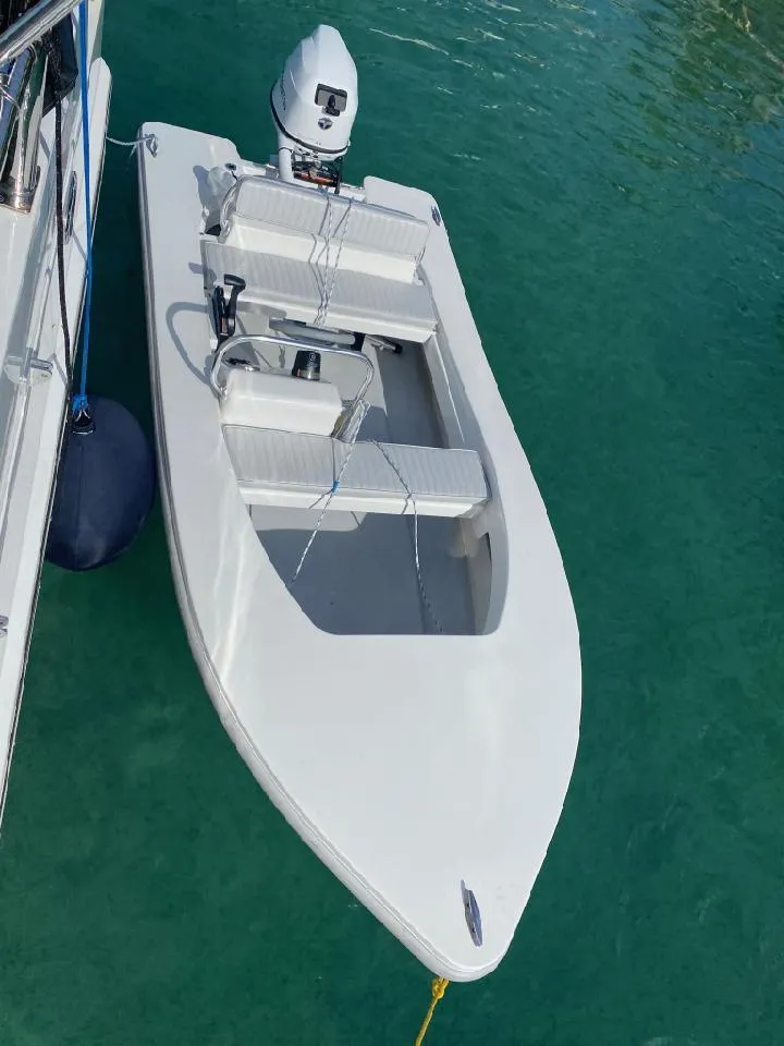 Slide: The Image of 2024 Ultra Lite Tenders Rigged 380 boat on clear water. - 12