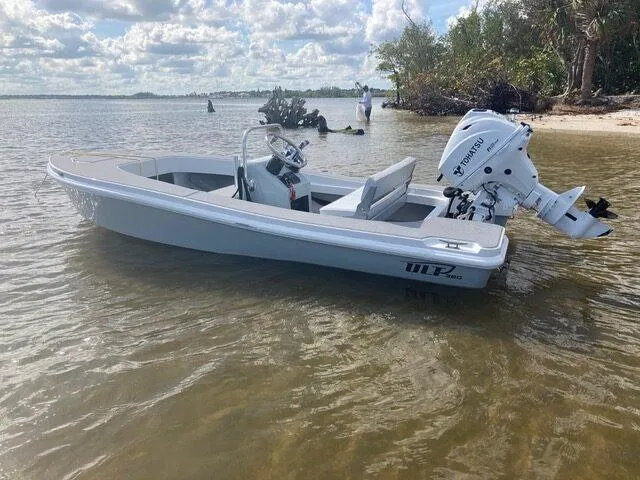 Slide: The Image of 2024 Ultra Lite Tenders Rigged 380 boat in shallow water. - 14