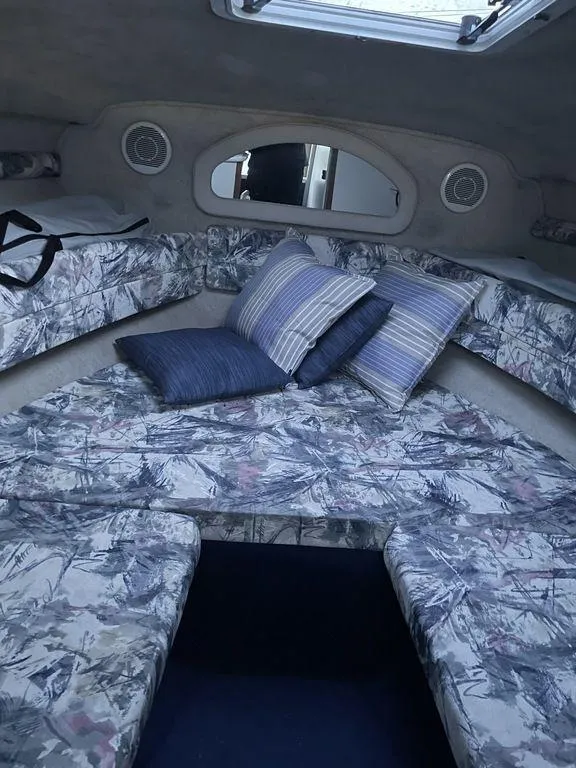 Slide: The Image of 1998 Sea Ray 240 Sundancer boat interior with safety warnings and control panel. - 10