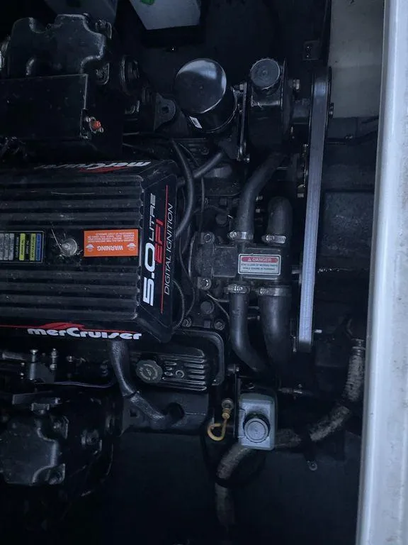 Slide: The Image of Dashboard of a 1998 Sea Ray 240 Sundancer boat with gauges and controls. - 16