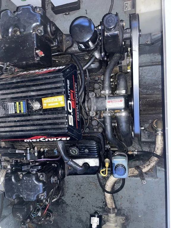 Slide: The Image of 1998 Sea Ray 240 Sundancer cabin interior with patterned upholstery and cushions. - 20