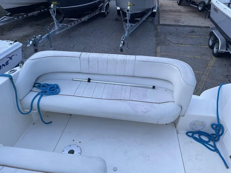 Slide: The Image of 1998 Sea Ray 240 Sundancer boat on trailer, showing stern and propeller. - 8