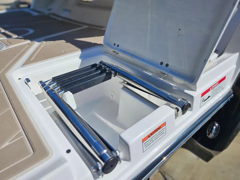Slide: The Image of 2025 Monterey 275SS boat with open storage compartment and stainless steel hardware. - 10