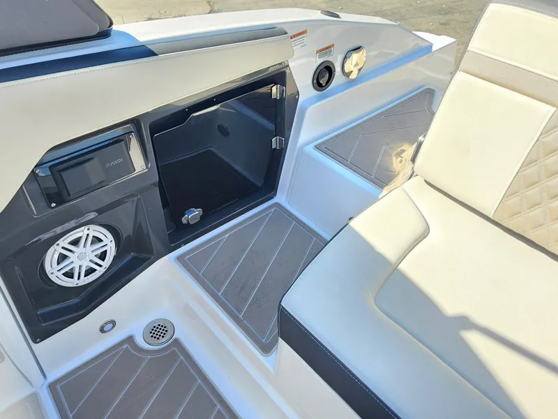 Slide: The Image of Interior of 2025 Monterey 275SS boat with seating and storage compartments. - 14