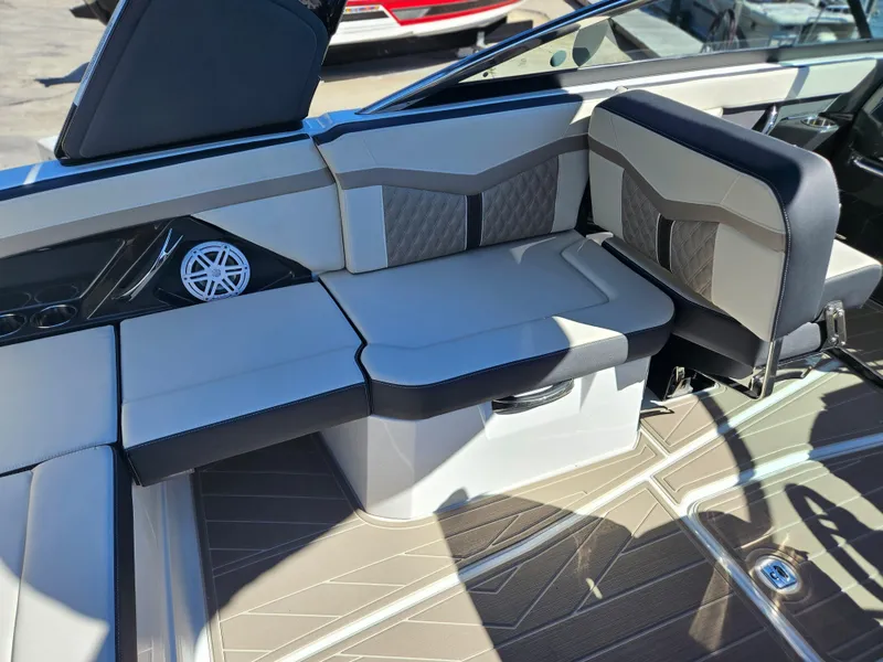 Slide: The Image of 2025 Monterey 275SS boat interior with cushioned seating and modern design. - 18