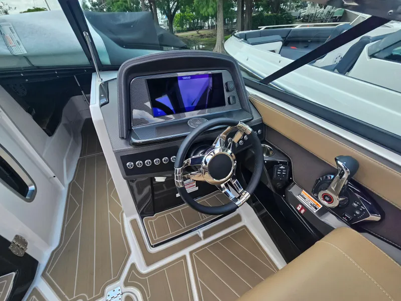 Slide: The Image of 2025 Monterey 275SS boat cockpit with modern steering and control panel. - 20