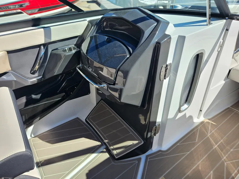 Slide: The Image of 2025 Monterey 275SS boat interior with modern helm and sleek design. - 22