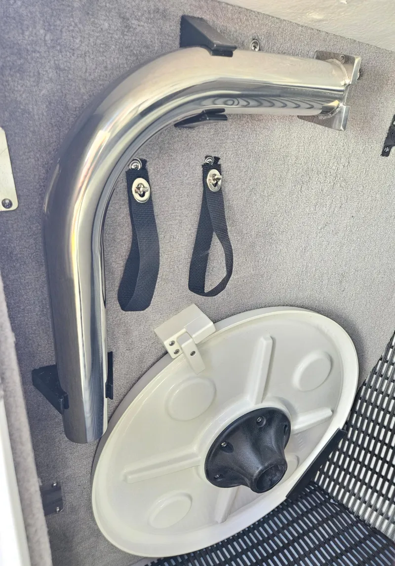 Slide: The Image of 2025 Monterey 275SS boat storage compartment with mounted accessories. - 25