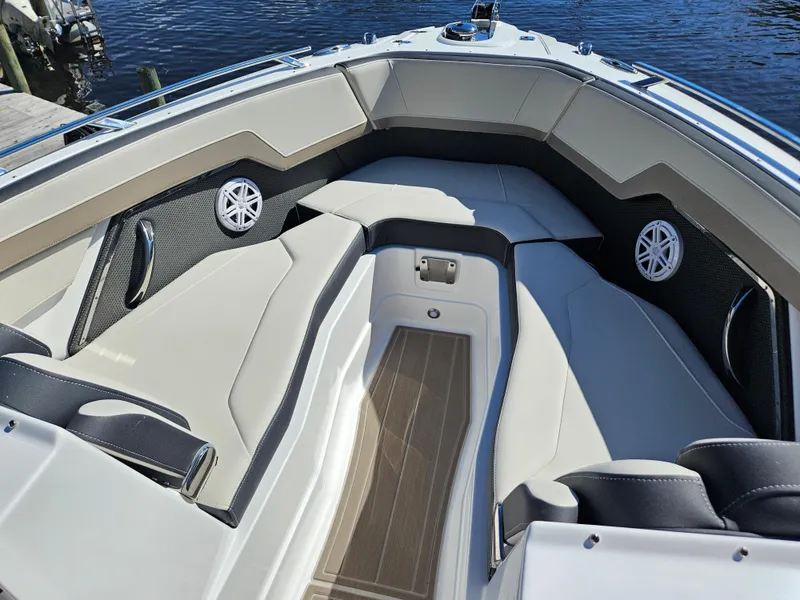 Slide: The Image of 2025 Monterey 275SS boat interior with cushioned seating and speakers. - 26