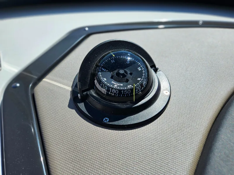 Slide: The Image of Close-up of a compass on a 2025 Monterey 275SS boat. - 29
