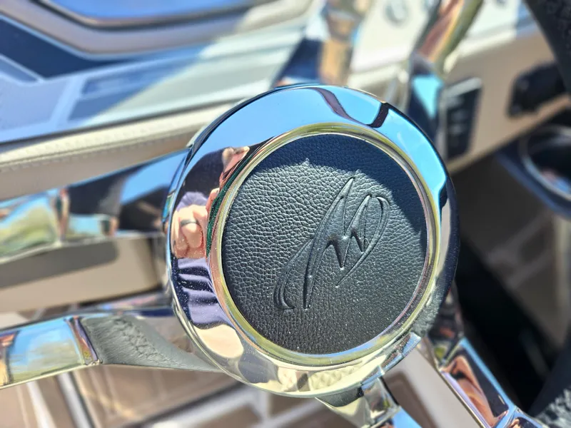 Slide: The Image of Close-up of the steering wheel of a 2025 Monterey 275SS boat. - 30