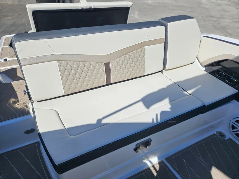 Slide: The Image of 2025 Monterey 275SS boat with luxurious beige and brown seating. - 36