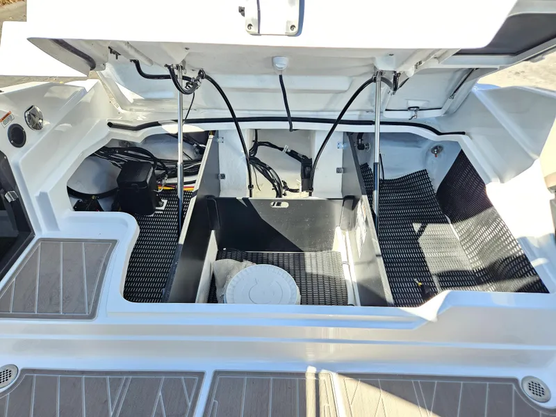 Slide: The Image of 2025 Monterey 275SS boat engine compartment with open hatch. - 37