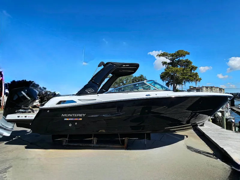 Slide: The Image of 2025 Monterey 275SS boat docked under clear blue sky. - 6