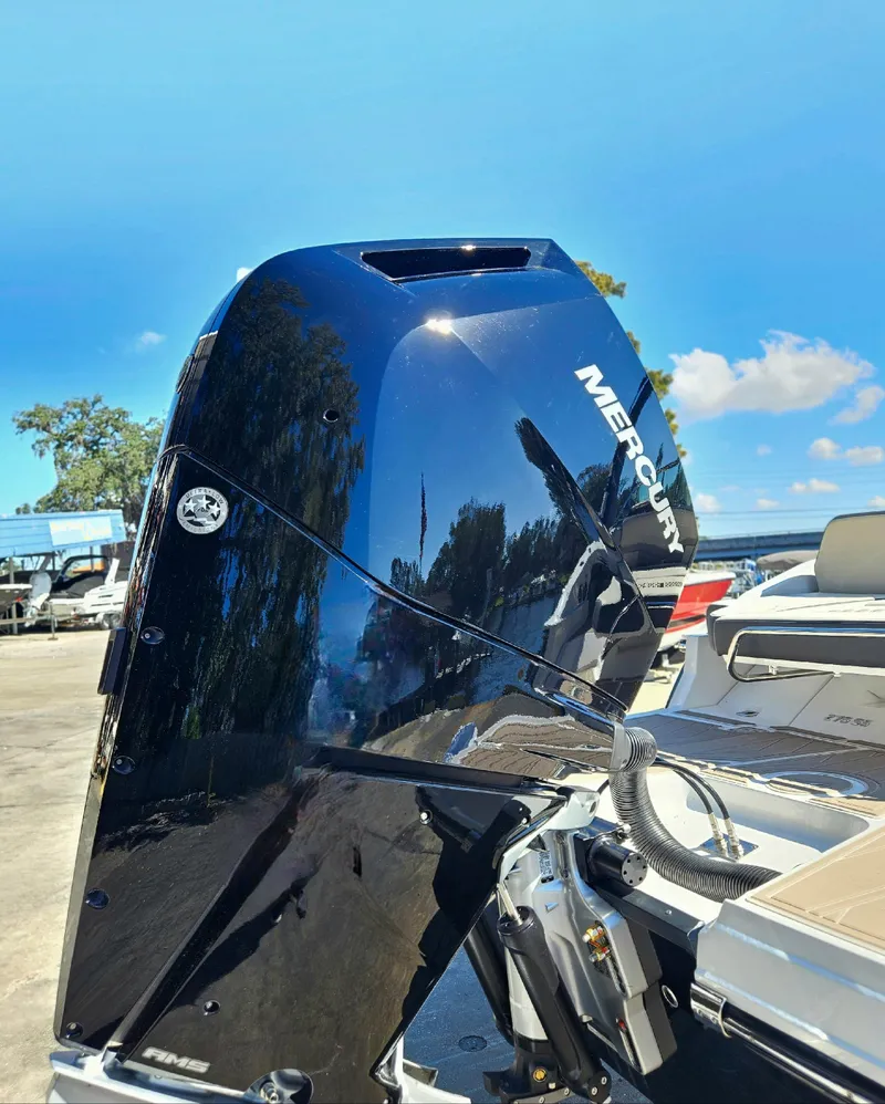 Slide: The Image of 2025 Monterey 275SS boat with Mercury outboard motor in a marina. - 3