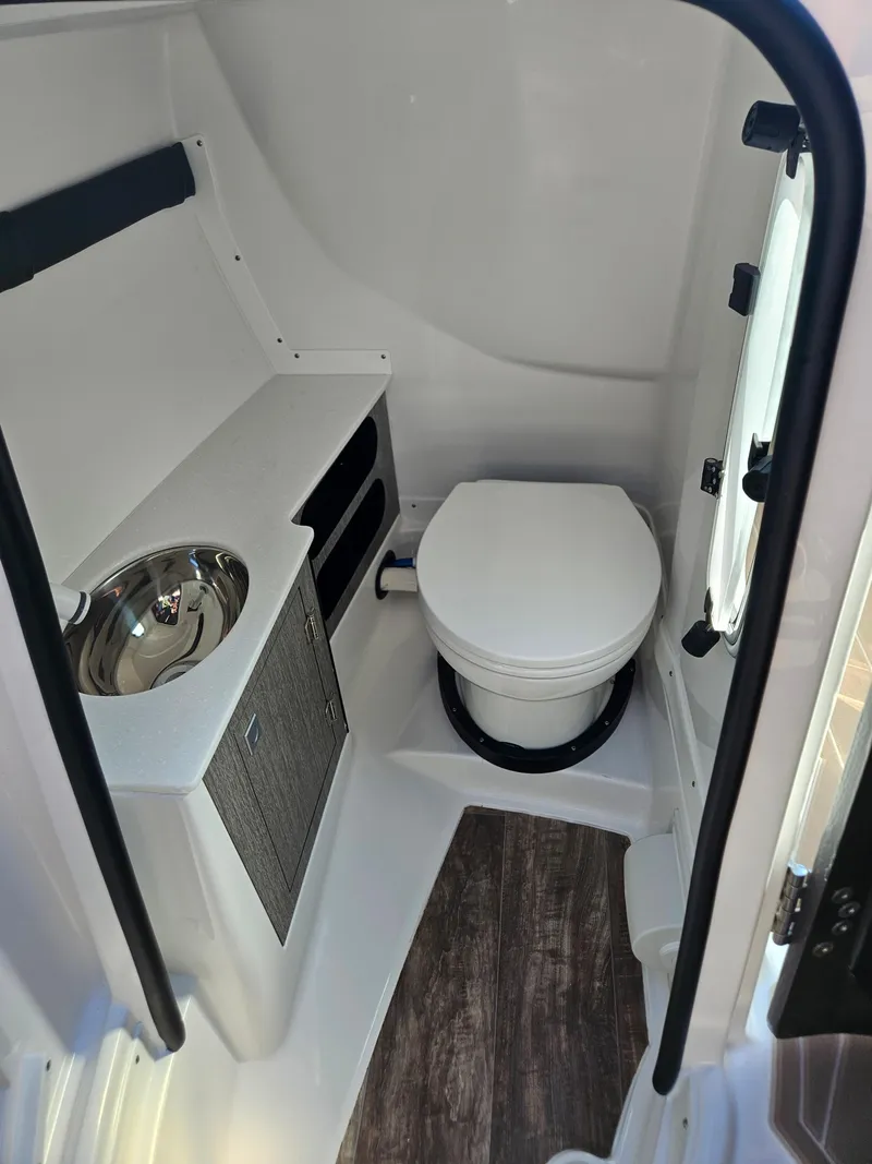 Slide: The Image of 2025 Monterey 275SS boat interior bathroom with sink and toilet. - 41