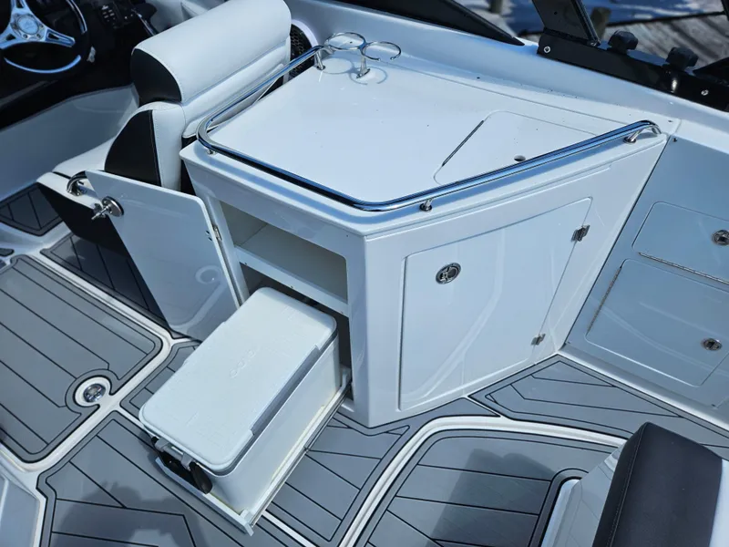 Slide: The Image of Interior of 2025 Monterey M-65 boat with storage and seating area. - 10