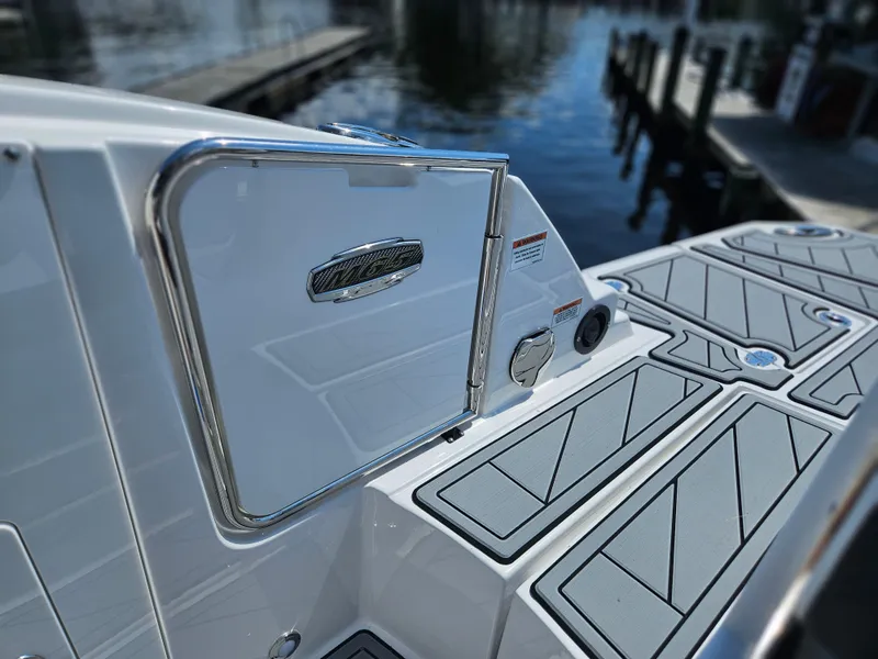 Slide: The Image of Monterey M-65 2025 boat deck with sleek design and water backdrop. - 14
