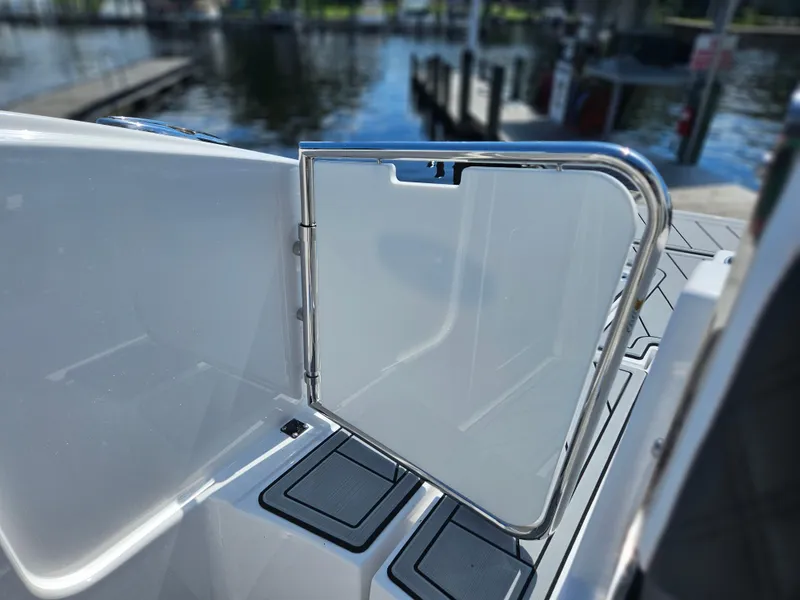 Slide: The Image of Monterey M-65 2025 boat with open stainless steel gate, dockside view. - 15
