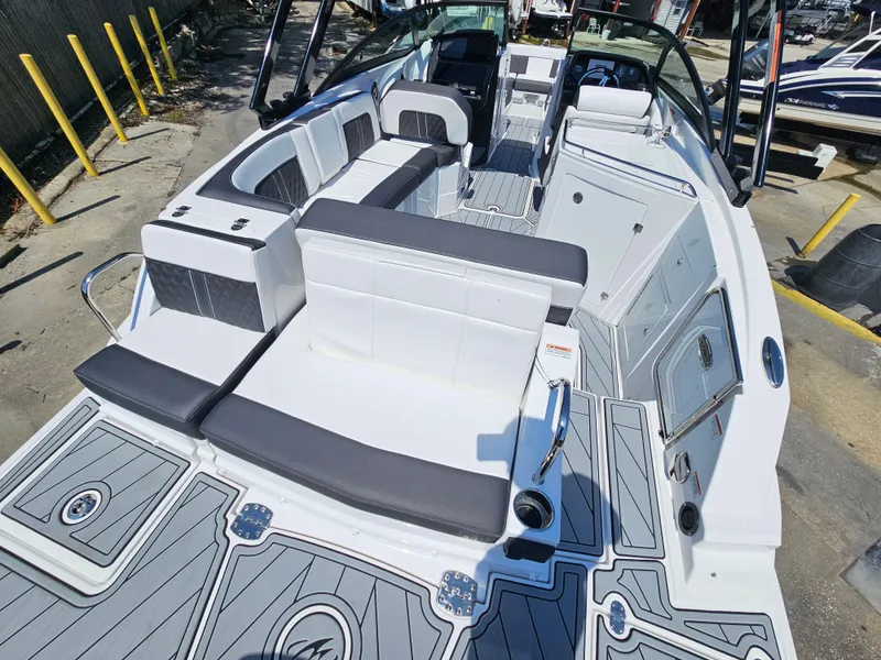 Slide: The Image of 2025 Monterey M-65 boat interior with sleek seating and modern design. - 18