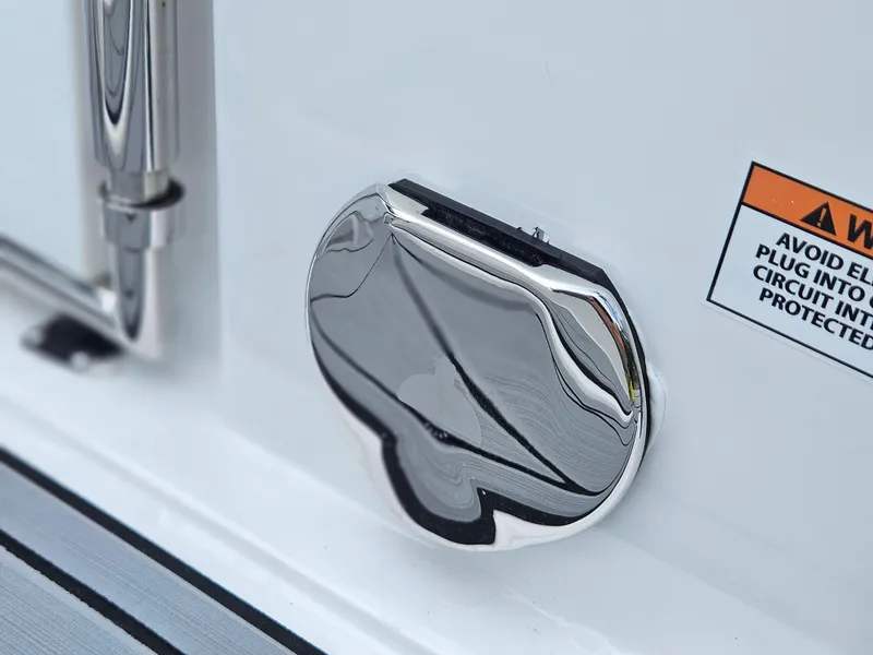 Slide: The Image of Chrome detail on 2025 Monterey M-65 boat with warning label. - 19