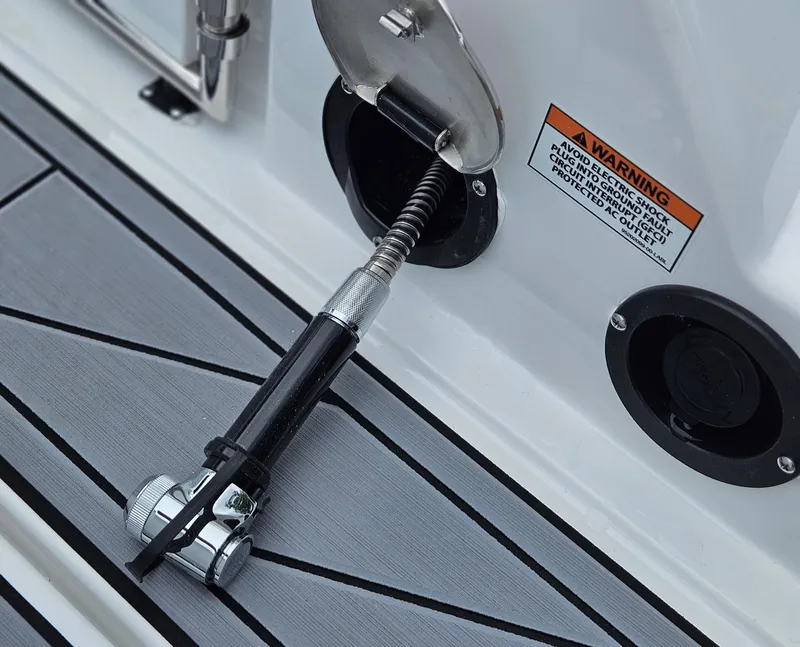 Slide: The Image of Fuel inlet and warning label on 2025 Monterey M-65 boat deck. - 20