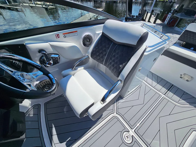 Slide: The Image of Luxury helm seat on 2025 Monterey M-65 boat, featuring sleek design and modern controls. - 22