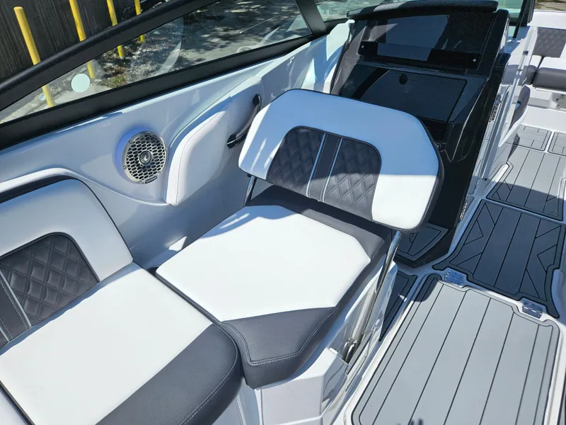 Slide: The Image of 2025 Monterey M-65 boat interior with sleek seating and modern design. - 28