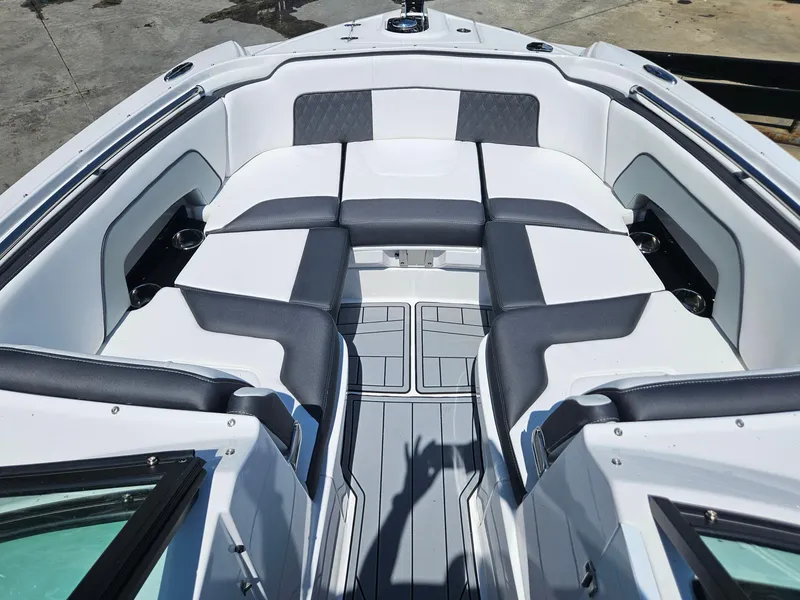 Slide: The Image of 2025 Monterey M-65 boat interior with sleek seating and modern design. - 33