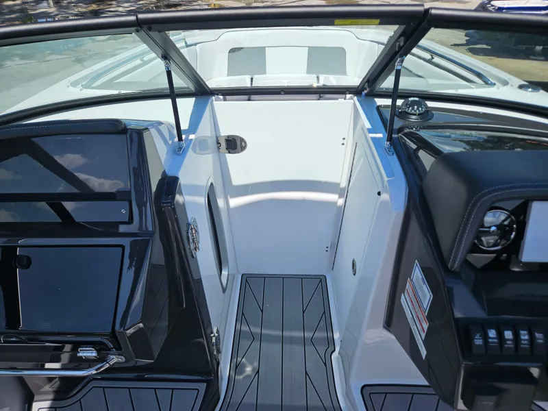 Slide: The Image of Modern 2025 Monterey M-65 boat interior with sleek design and advanced dashboard features. - 34