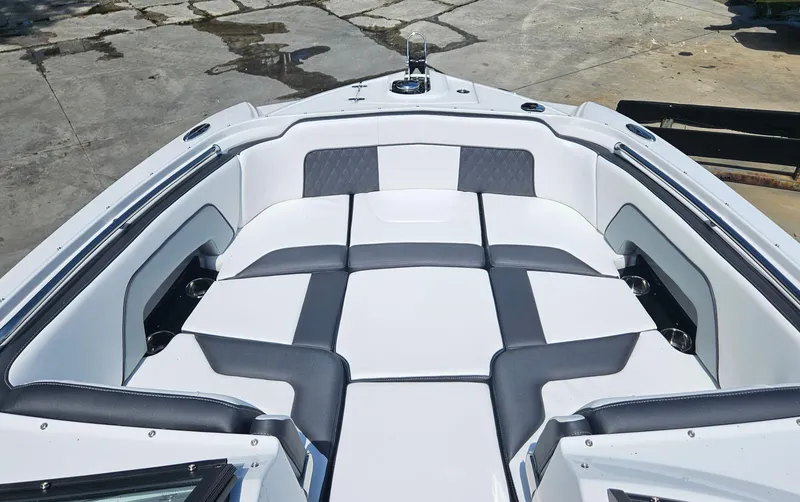 Slide: The Image of 2025 Monterey M-65 boat interior with cushioned seating, featuring modern design and spacious layout. - 36