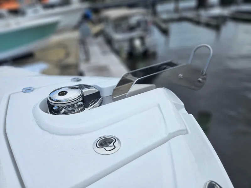 Slide: The Image of Close-up of a 2025 Monterey M-65 boat's anchor system at a marina. - 39