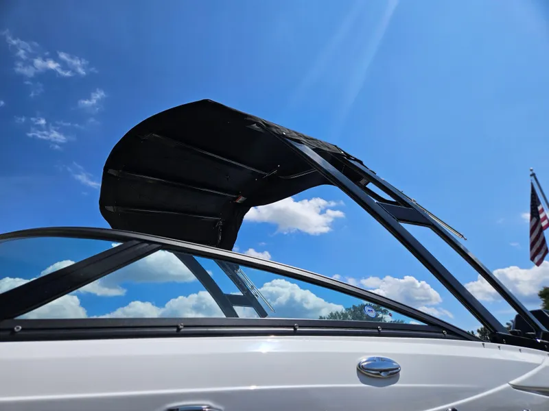 Slide: The Image of 2025 Monterey M-65 boat against a clear blue sky with clouds. - 7