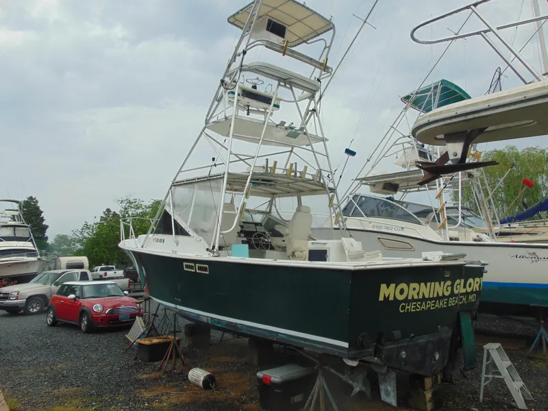 Slide: The Image of 1987 Black Watch Sportfish boat "Morning Glory" on land, Chesapeake Beach, with tower and equipment. - 3