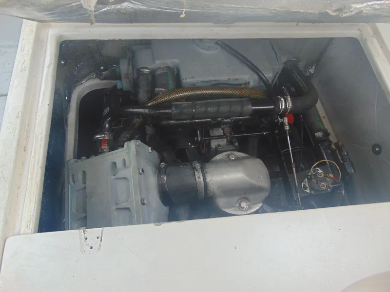 Slide: The Image of 1987 Black Watch Sportfish engine compartment with visible components and wiring. - 9