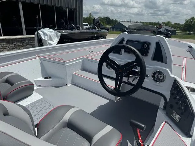 Slide: The Image of 2024 Xpress Boats H18 interior with steering wheel and seating. - 4
