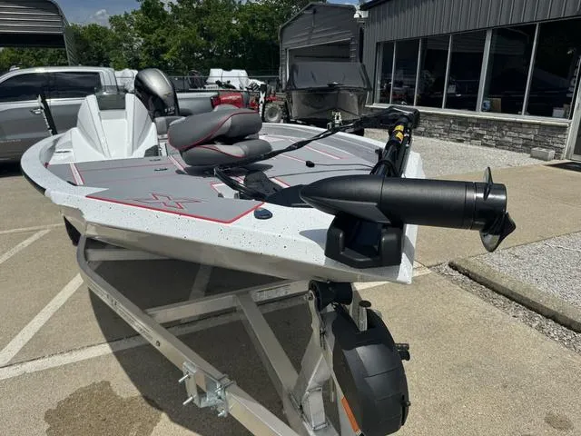 Slide: The Image of 2024 Xpress Boats H18 on trailer, front view, parked outdoors. - 7