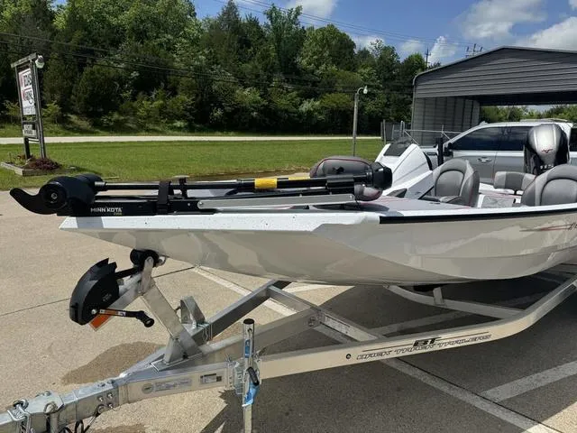 Slide: The Image of 2024 Xpress Boats H18 on a trailer, parked outdoors. - 9