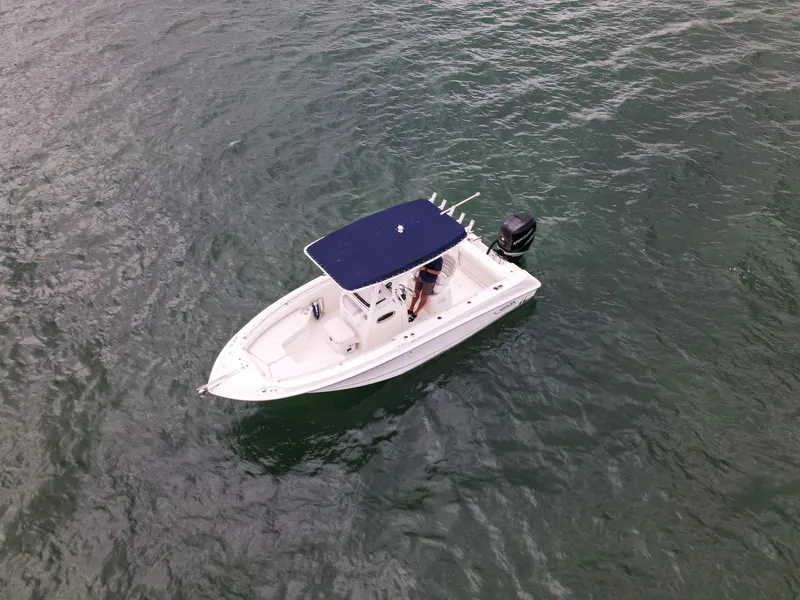 Slide: The Image of 2015 Boston Whaler 220 Outrage boat on open water, aerial view. - 10