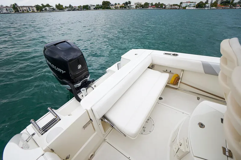 Slide: The Image of 2015 Boston Whaler 220 Outrage boat with Mercury outboard engine on water. - 12