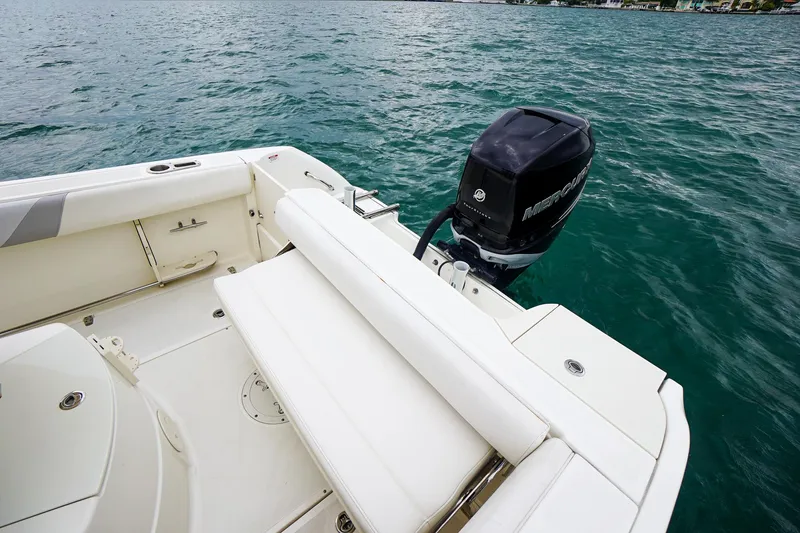 Slide: The Image of 2015 Boston Whaler 220 Outrage boat with Mercury outboard motor on water. - 13