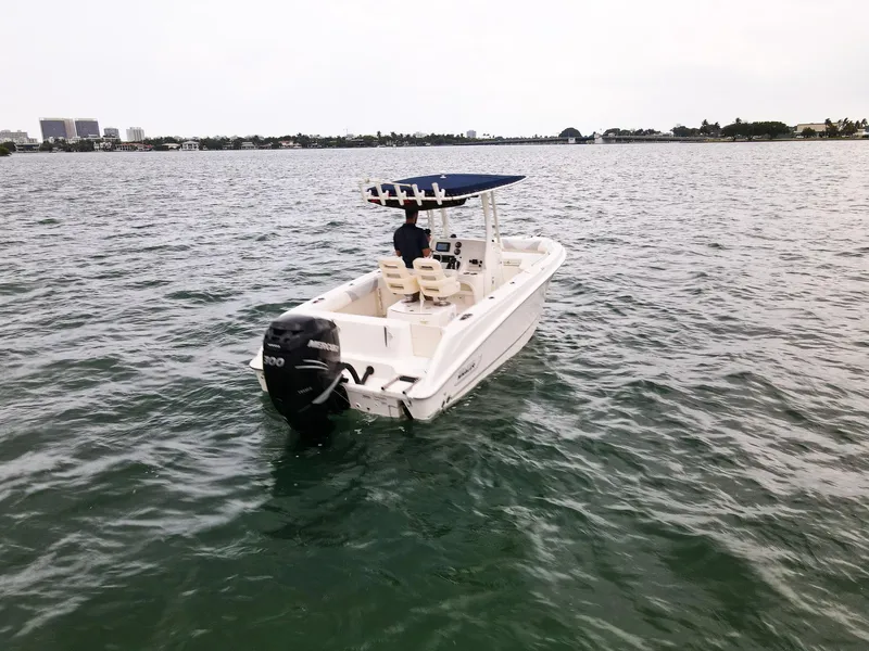 Slide: The Image of 2015 Boston Whaler 220 Outrage boat on open water. - 7