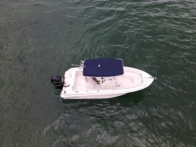 Slide: The Image of 2015 Boston Whaler 220 Outrage boat on open water. - 9